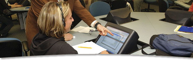 student getting assistance at computer
